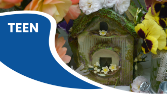 Decorative fairy house surrounded by colorful flowers with "TEEN" written on a blue area.