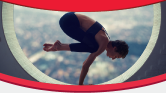 Person performing a yoga pose within a circular frame against a blurred cityscape background.