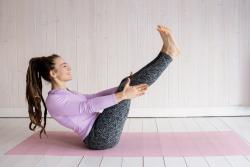 woman in purple pilates