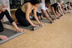 people rolling up yoga mats