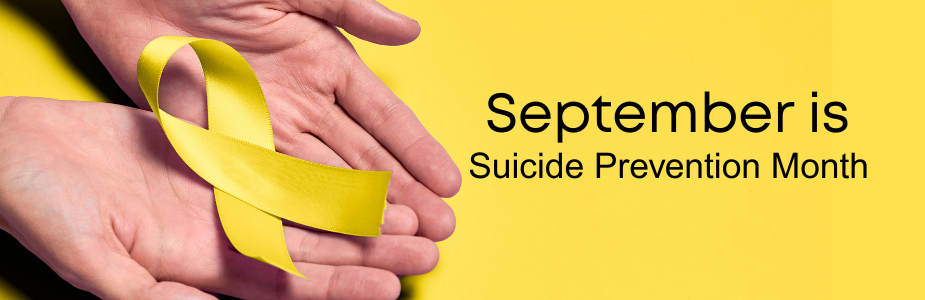 Two open hands holding a yellow ribbon against a yellow background with text that reads "September is Suicide Prevention Month."