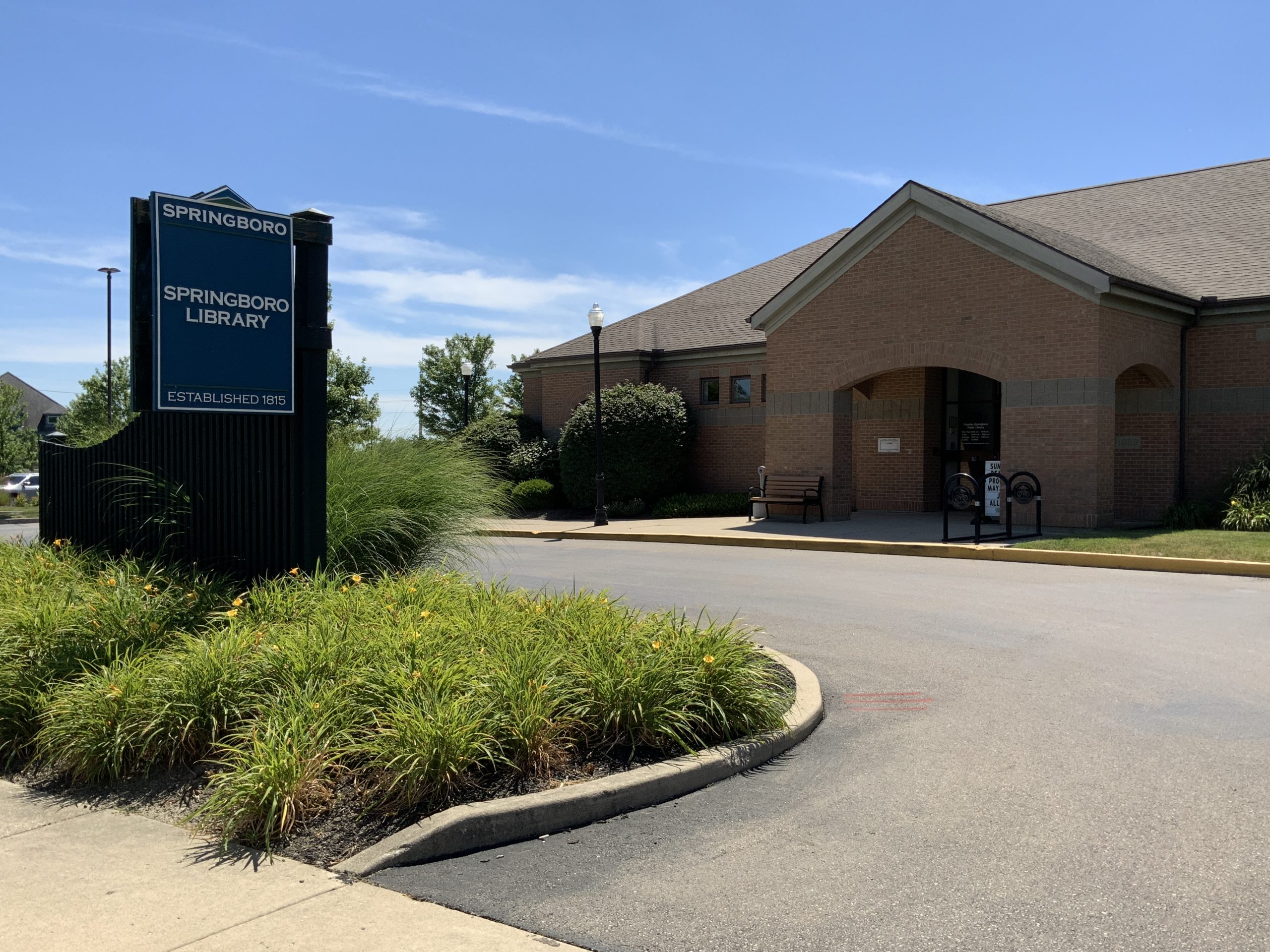 Springboro Library building with a sign and landscaped front yard.